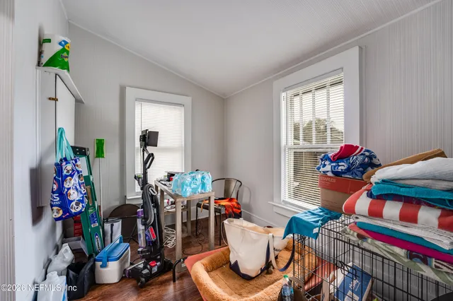 a living room with furniture a fireplace and a table