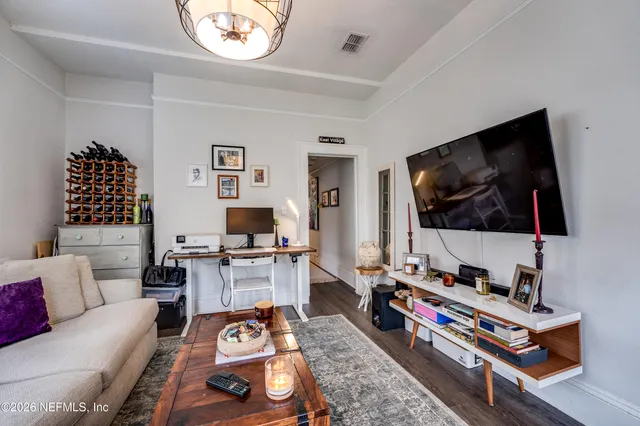 a bathroom with a sink a toilet and shower curtain