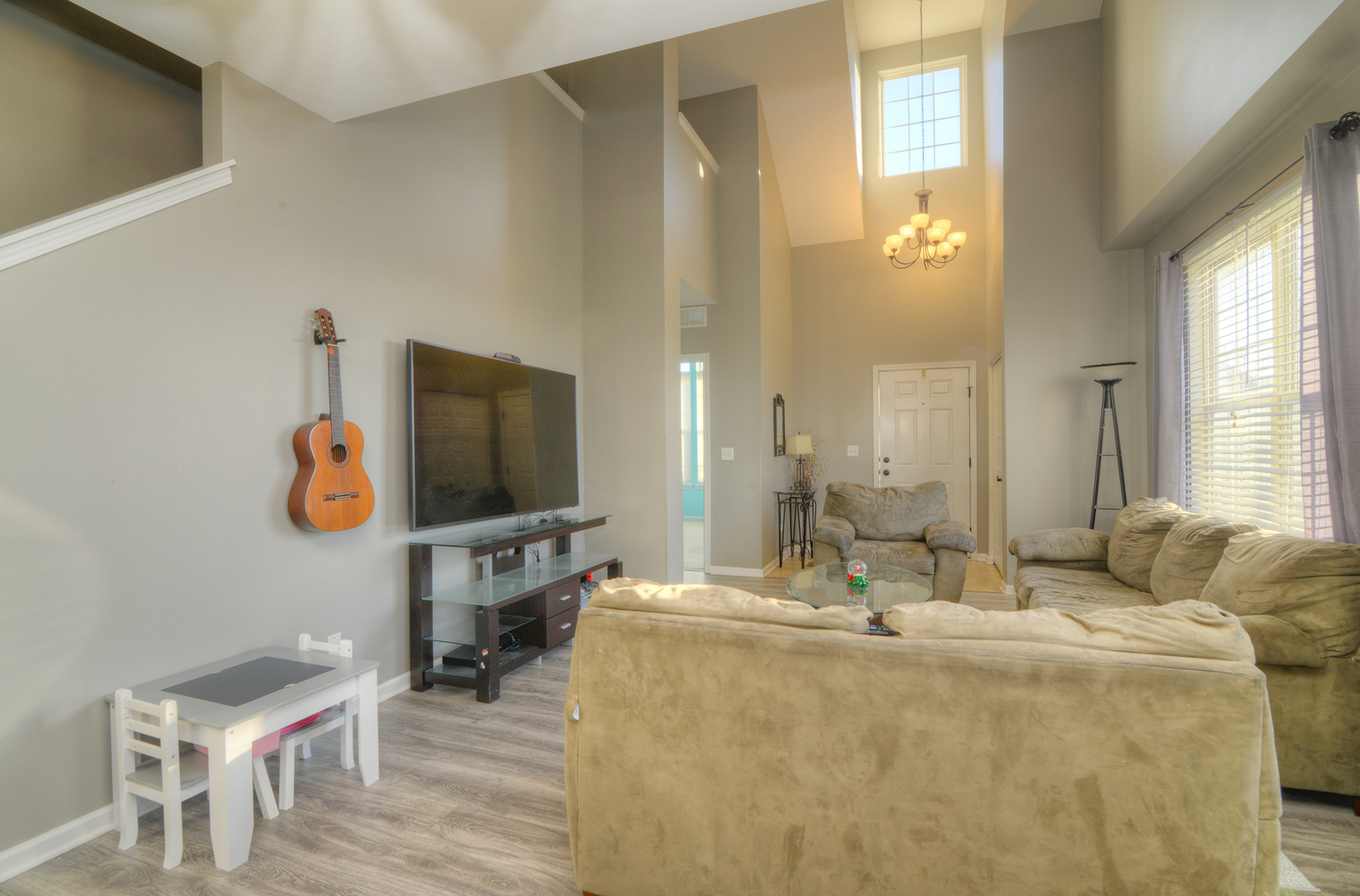 1218 Mariemont Road, Unit A Sugar Grove, IL 60554 - Photo 16 of 34 a living room with furniture and a flat screen tv