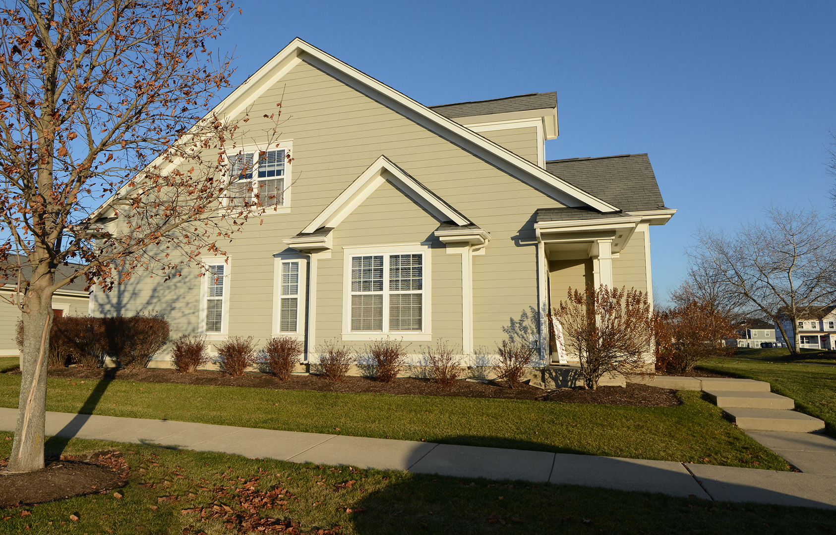 1218 Mariemont Road, Unit A Sugar Grove, IL 60554 - Photo 4 of 34 a front view of a house with a yard