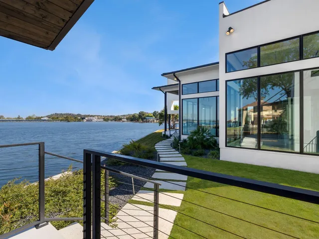 a view of a balcony with chair and table