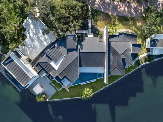 an aerial view of house with yard