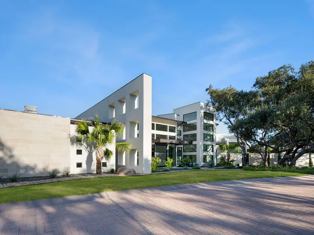 a view of a building with a yard