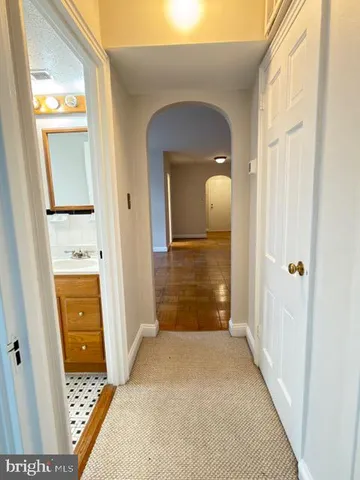 a view of a hallway view with wooden floor and staircase