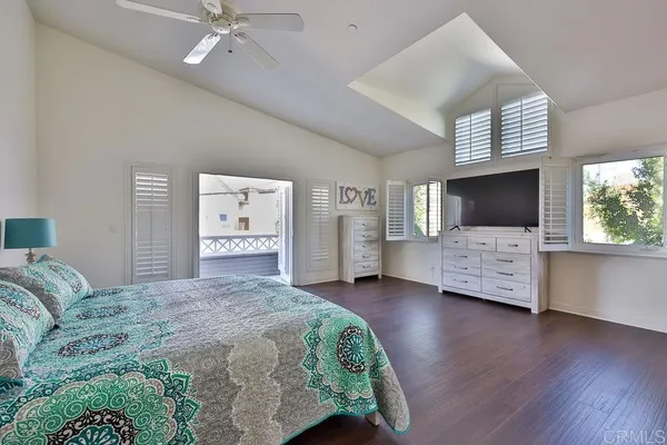a view of bedroom with wooden floor