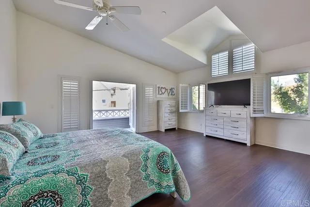 a view of bedroom with wooden floor