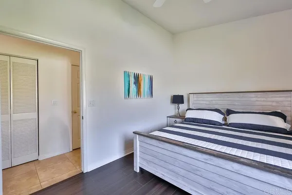 a bed room with a large bed and a window