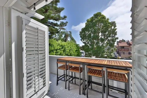 a view of chair and table in the balcony