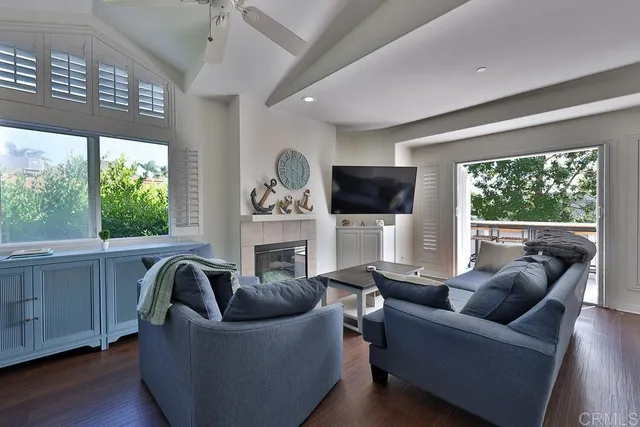 a view of a house with backyard sitting area and garden