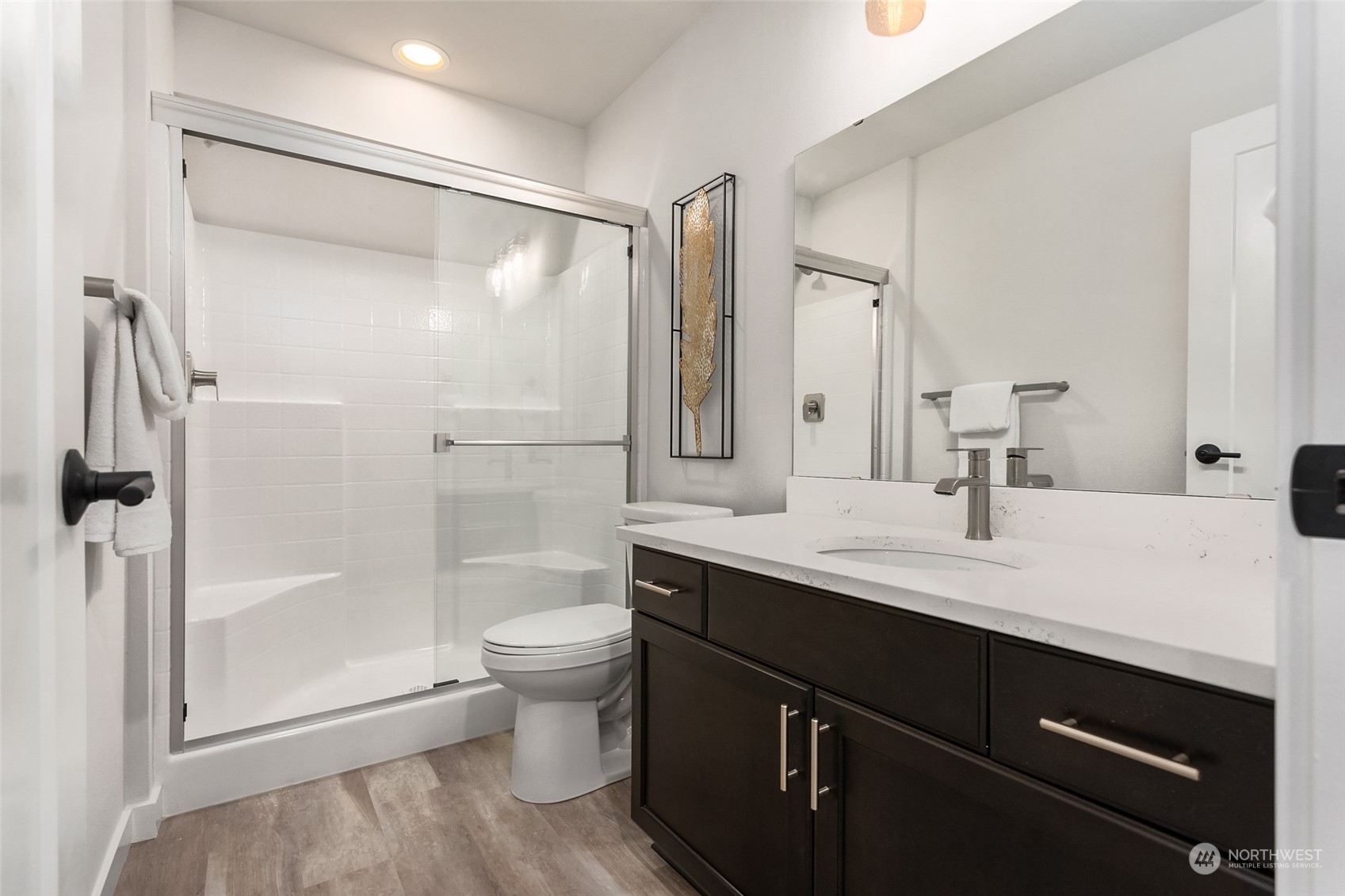 616 237th Place Southeast, Unit E Bothell, WA 98021 - Photo 15 of 27 a bathroom with a sink a toilet and shower