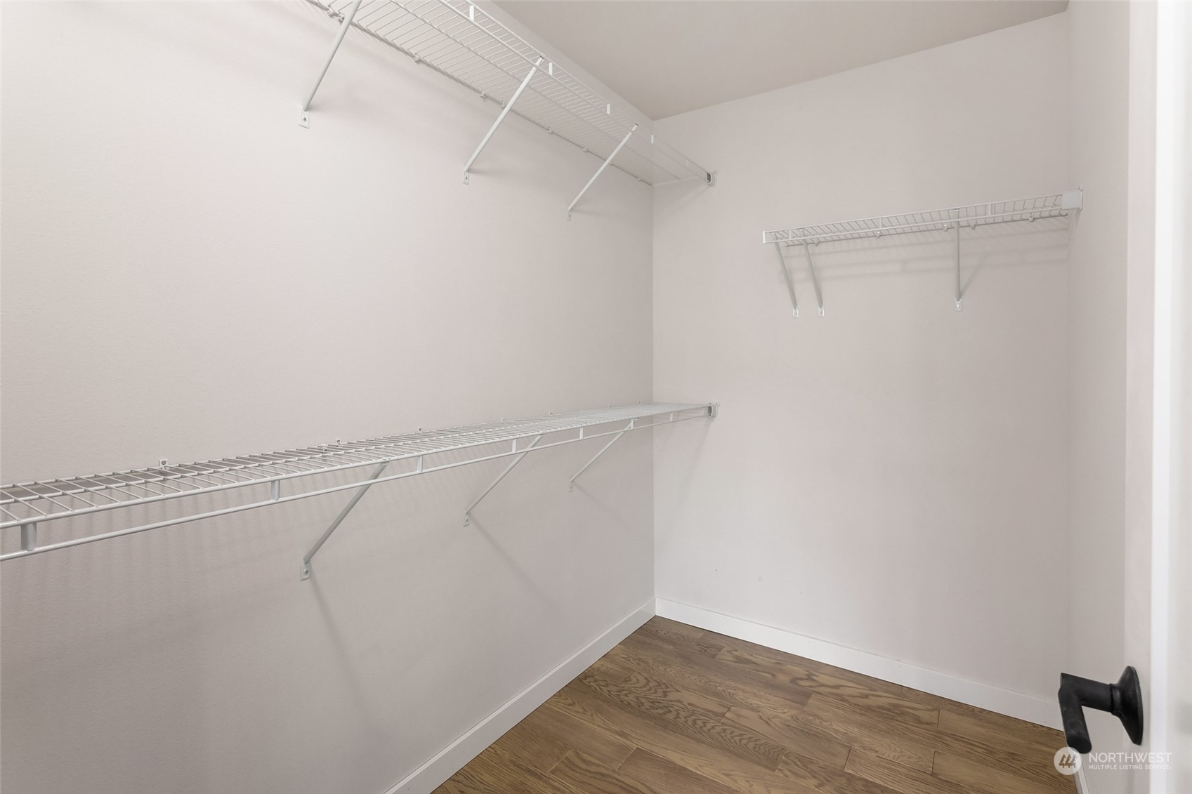 616 237th Place Southeast, Unit E Bothell, WA 98021 - Photo 18 of 27 a view of a room with racks on the wall