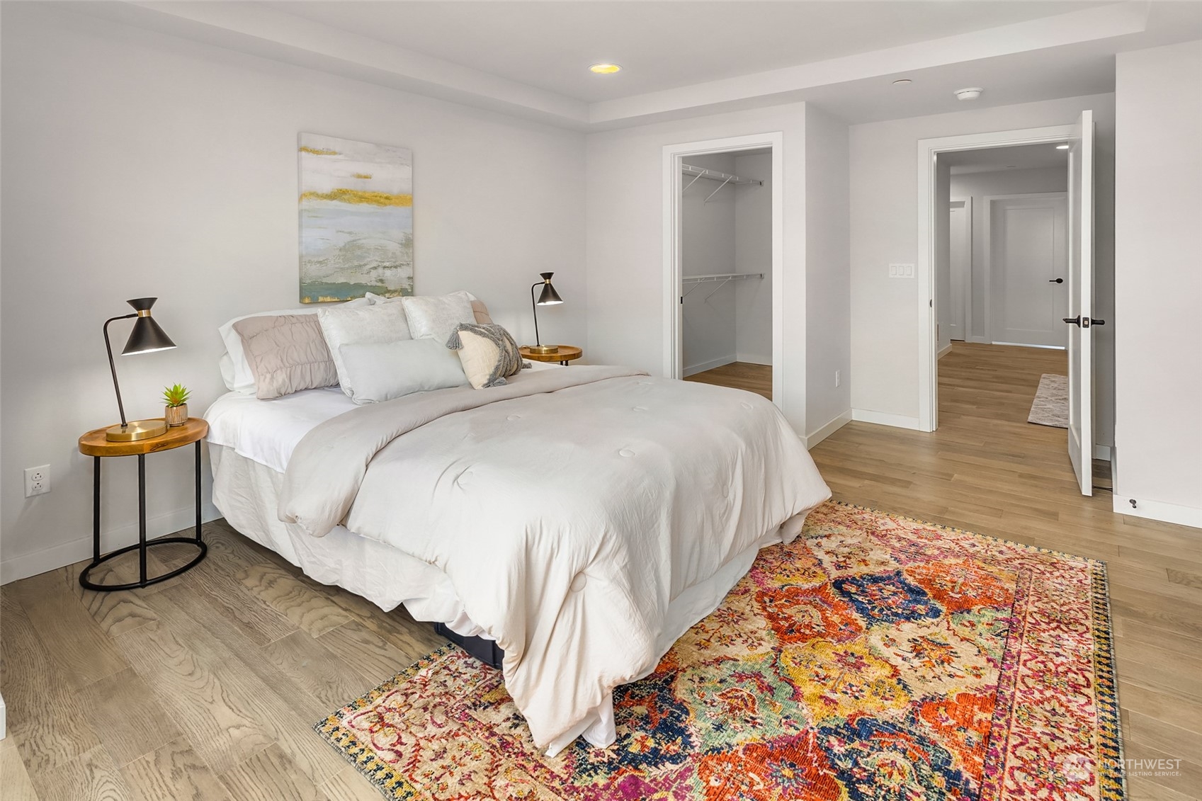 616 237th Place Southeast, Unit E Bothell, WA 98021 - Photo 19 of 27 a bedroom with bed and a lamp