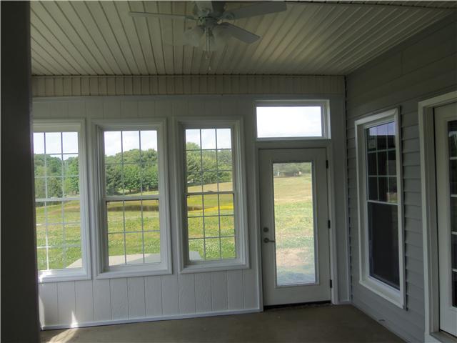 1250 Carter Blake Road Tullahoma, TN 37388 - Photo 5 of 20 The sun porch is located on the back of home featuring new paint and ceiling fan. You can access the porch from the living room area and the den area. Also, there is a door leading to back patio area...