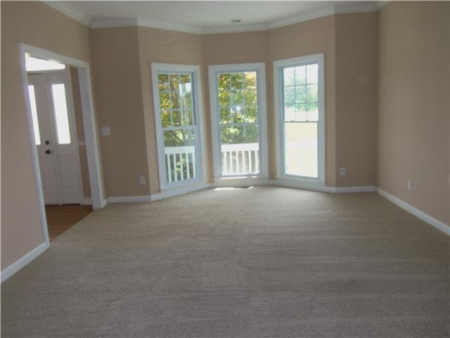 1250 Carter Blake Road Tullahoma, TN 37388 - Photo 7 of 20 The living room area is 19x14, has new paint and new carpet. This room also features a bay window in front of home and has access to the sun porch on the back side.