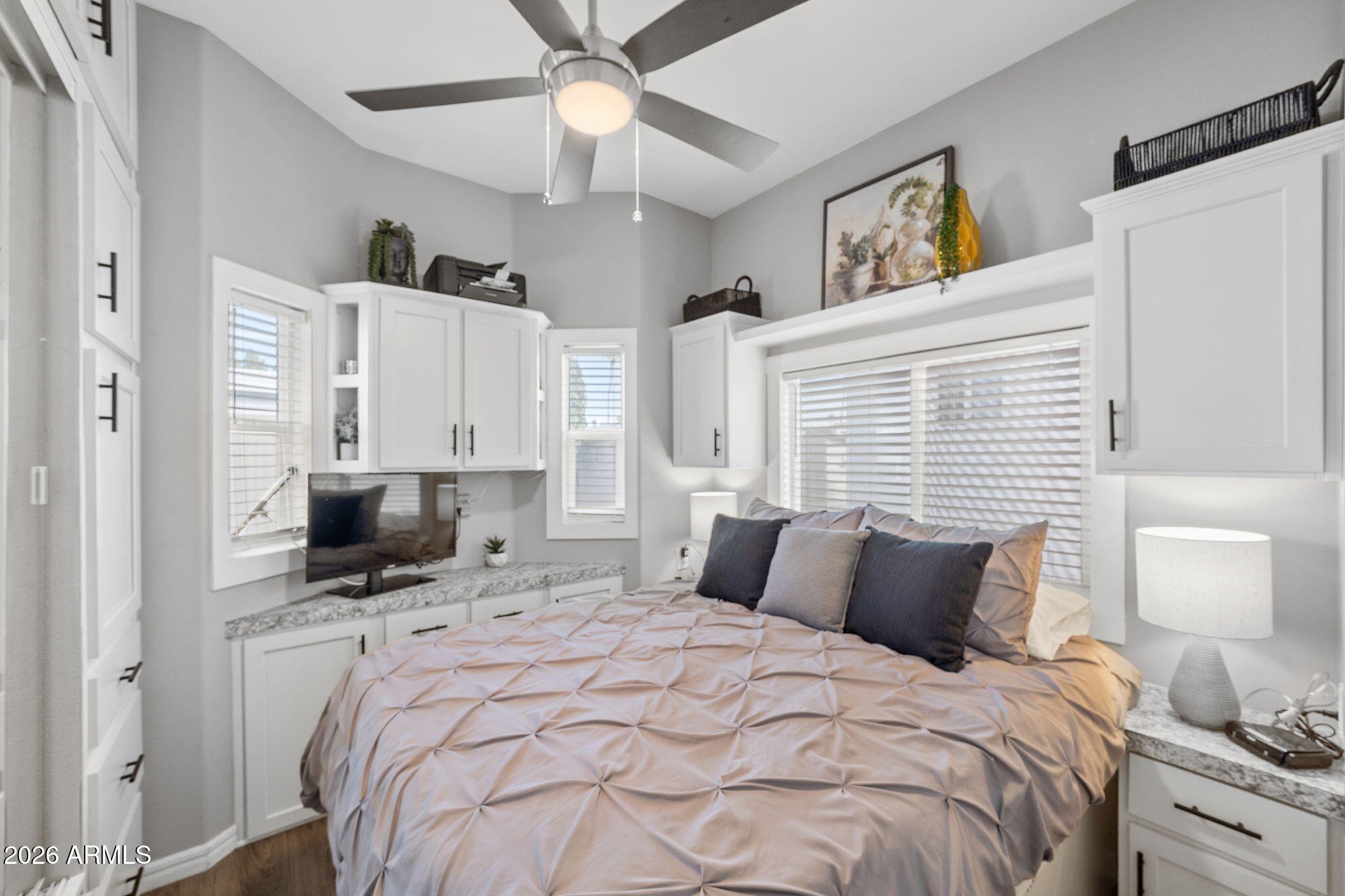 111 South Greenfield Road, Unit 527 Mesa, AZ 85206 - Photo 13 of 15 a bedroom with a bed and a chandelier
