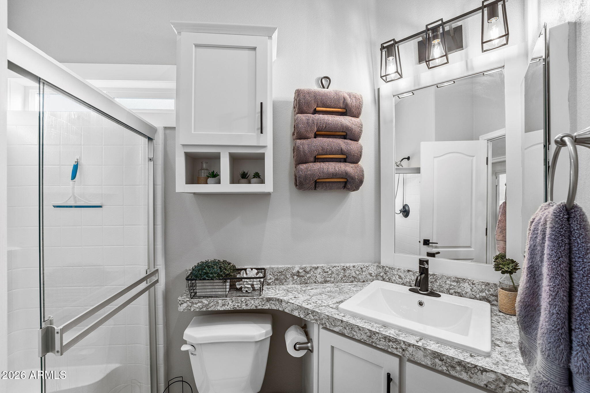 111 South Greenfield Road, Unit 527 Mesa, AZ 85206 - Photo 14 of 15 a bathroom with a sink toilet and shower
