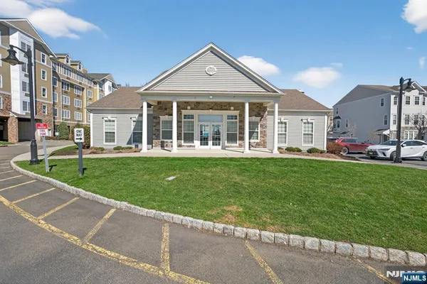 a front view of a house with a yard table and chairs