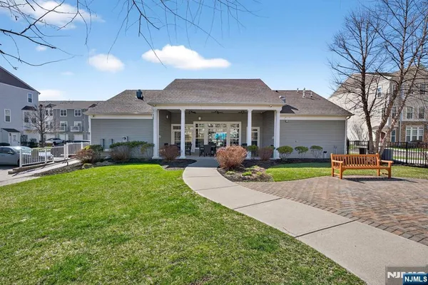 a view of a house with swimming pool and a yard