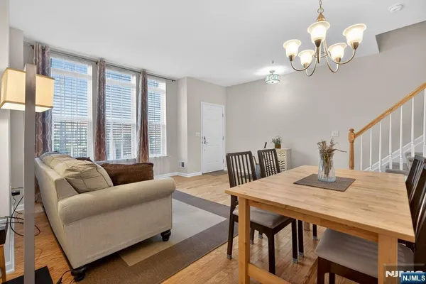 a view of a dining room with furniture and a large window