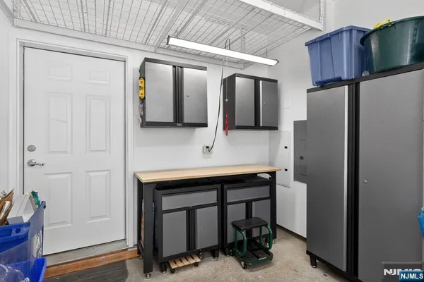 a kitchen with stainless steel appliances a refrigerator and cabinets