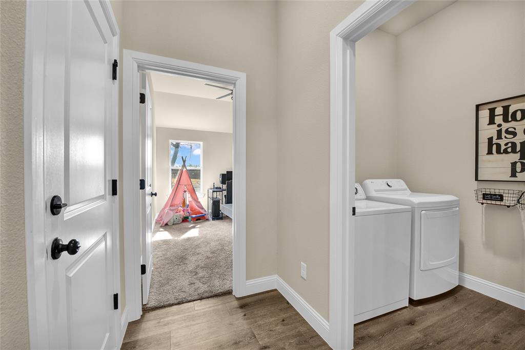 2044 Redemption Drive Weatherford, TX 76088 - Photo 13 of 30 a view of a storage & utility room with a washer and dryer