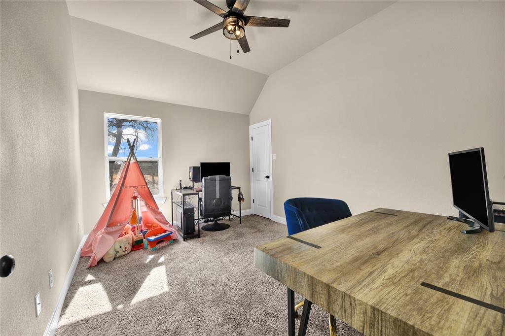 2044 Redemption Drive Weatherford, TX 76088 - Photo 15 of 30 a bedroom with a bed and a flat screen tv