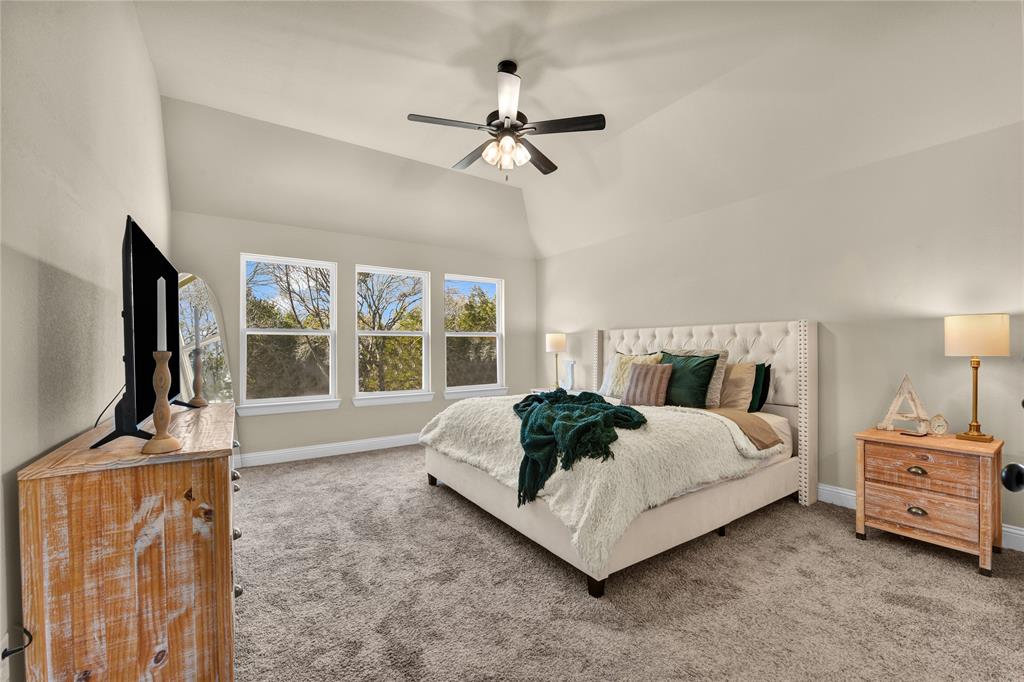 2044 Redemption Drive Weatherford, TX 76088 - Photo 16 of 30 a living room with a bed furniture and a flat screen tv