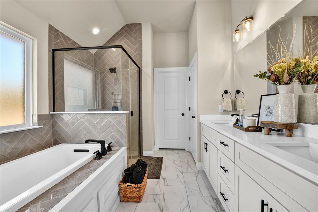 2044 Redemption Drive Weatherford, TX 76088 - Photo 18 of 30 a bathroom with a tub sink and mirror