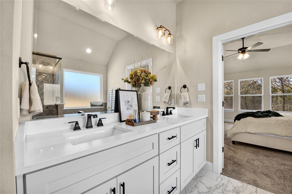 2044 Redemption Drive Weatherford, TX 76088 - Photo 20 of 30 a en suite bathroom with double sink and a mirror