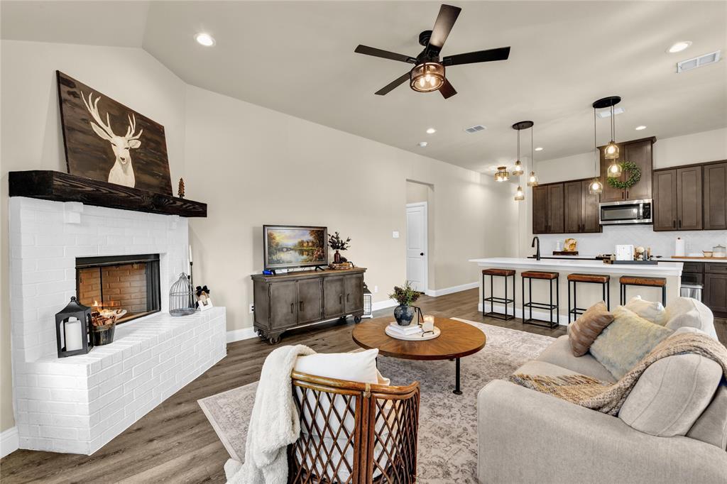 2044 Redemption Drive Weatherford, TX 76088 - Photo 26 of 30 a living room with furniture a fireplace and a flat screen tv