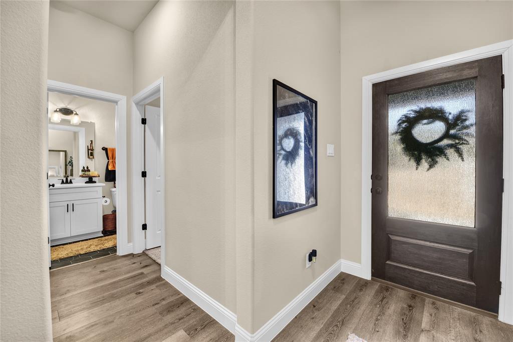 2044 Redemption Drive Weatherford, TX 76088 - Photo 9 of 30 a view of an entryway and wooden floor