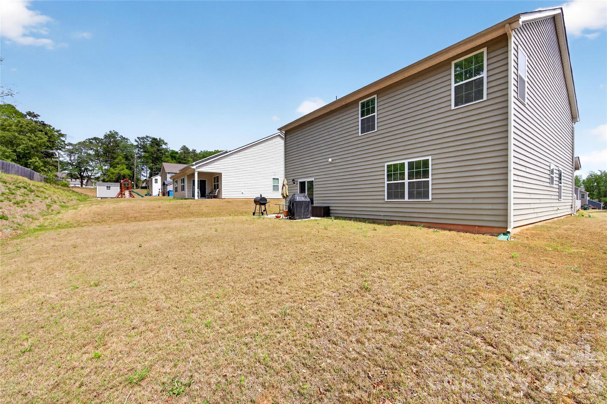 111 Beech Tree Lane Locust, NC 28097 - Photo 24 of 25 a view of livingroom with yard and staircase