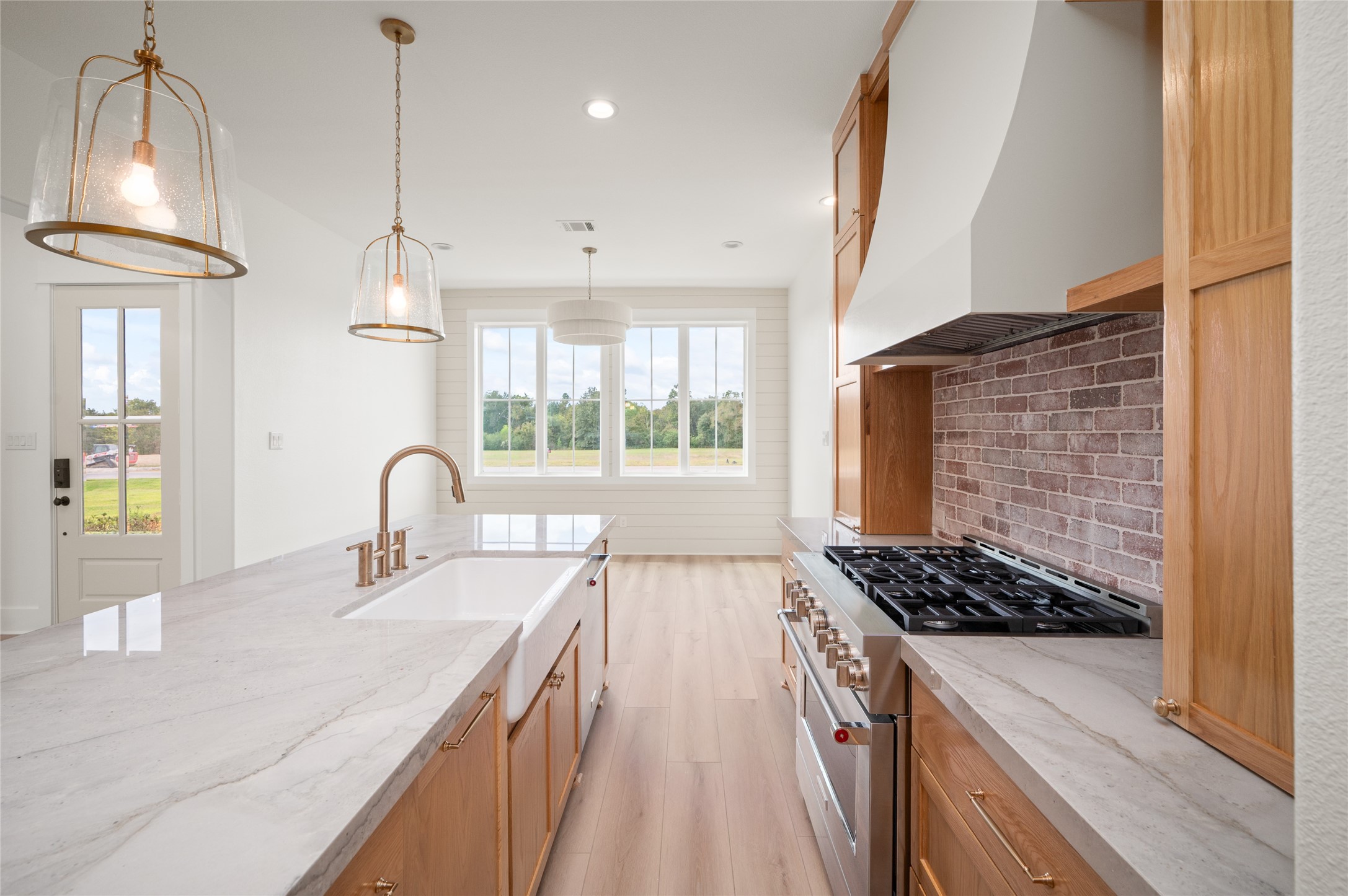 24940 Hopeview Way Montgomery, TX 77356 - Photo 22 of 49 a kitchen with sink stove and cabinets