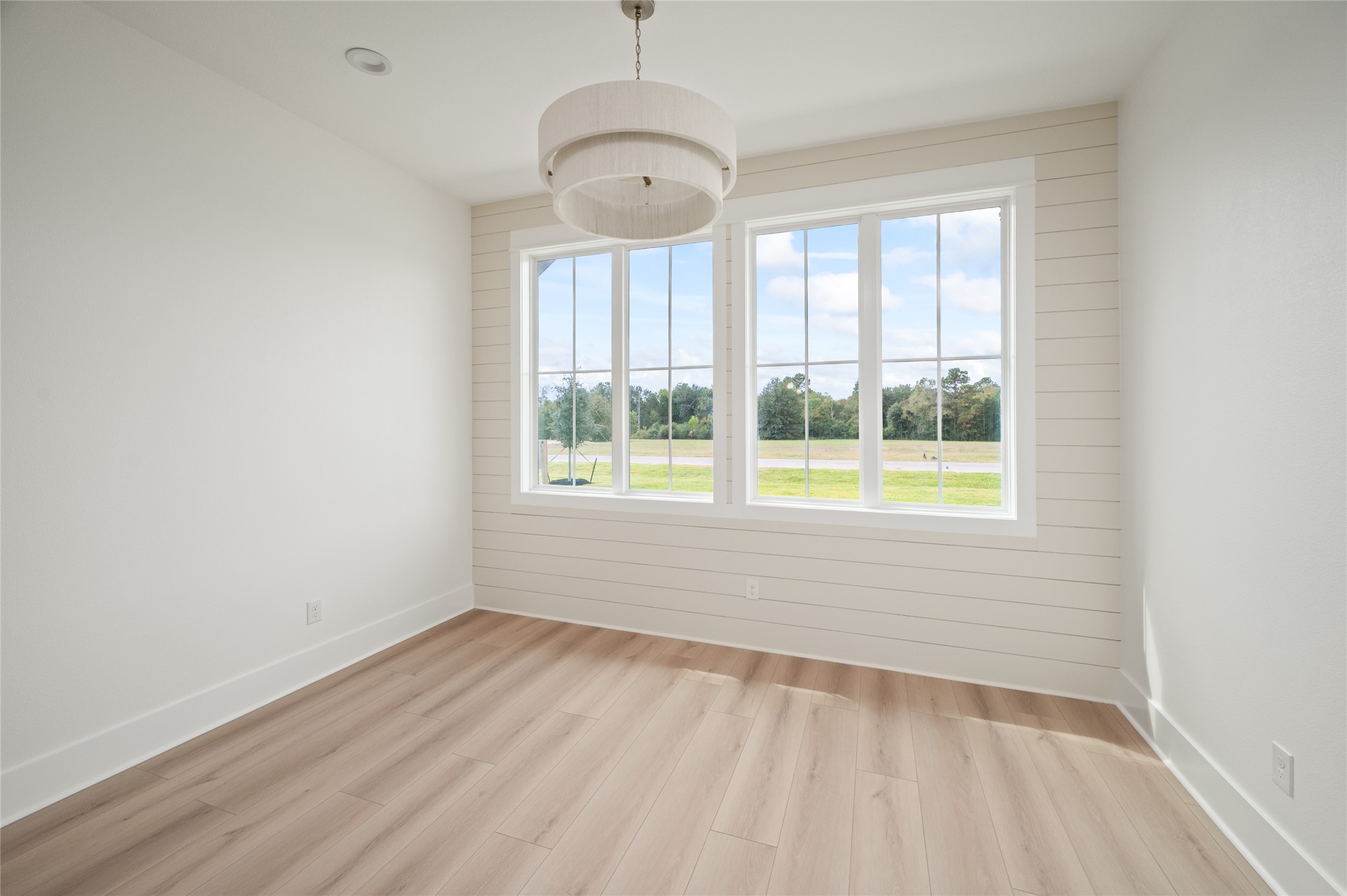 24940 Hopeview Way Montgomery, TX 77356 - Photo 23 of 49 an empty room with wooden floor and windows