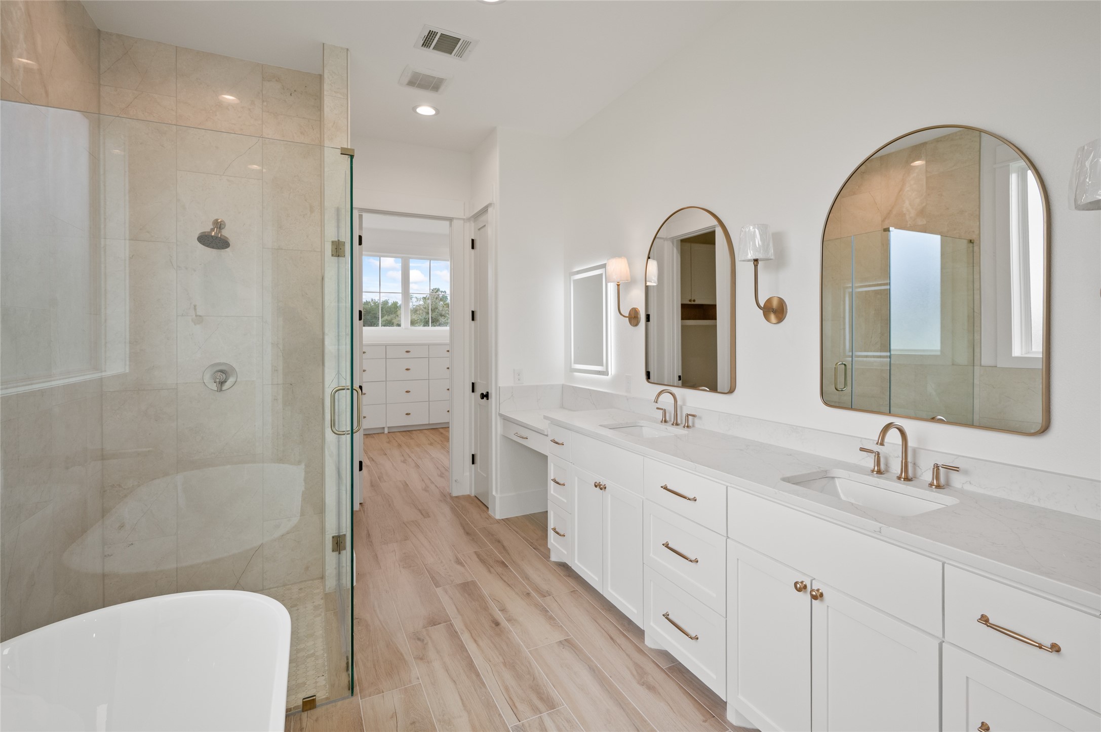 24940 Hopeview Way Montgomery, TX 77356 - Photo 38 of 49 a bathroom with a double vanity sink a toilet and shower