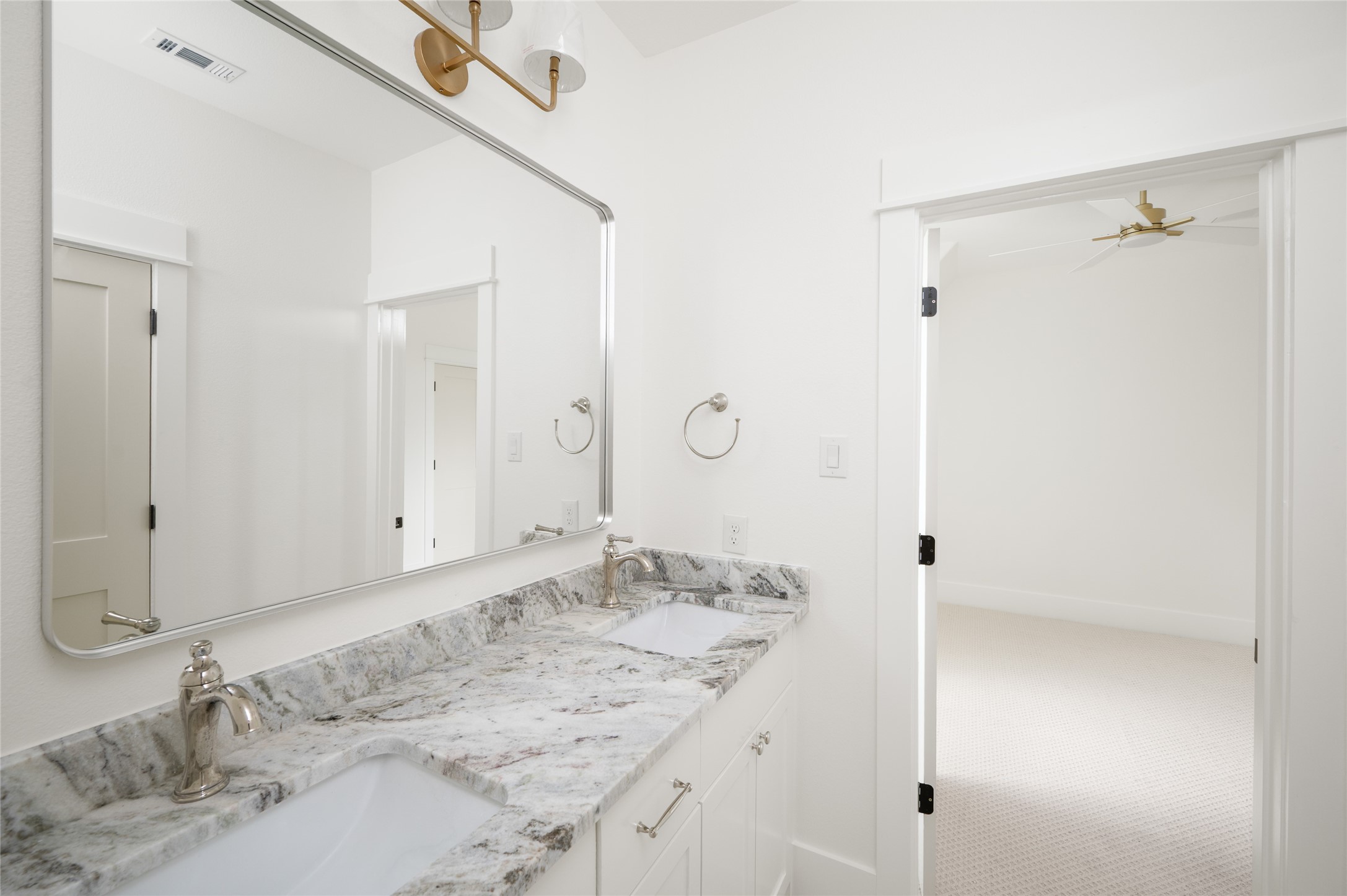 24940 Hopeview Way Montgomery, TX 77356 - Photo 43 of 49 a bathroom with a granite countertop sink and a mirror
