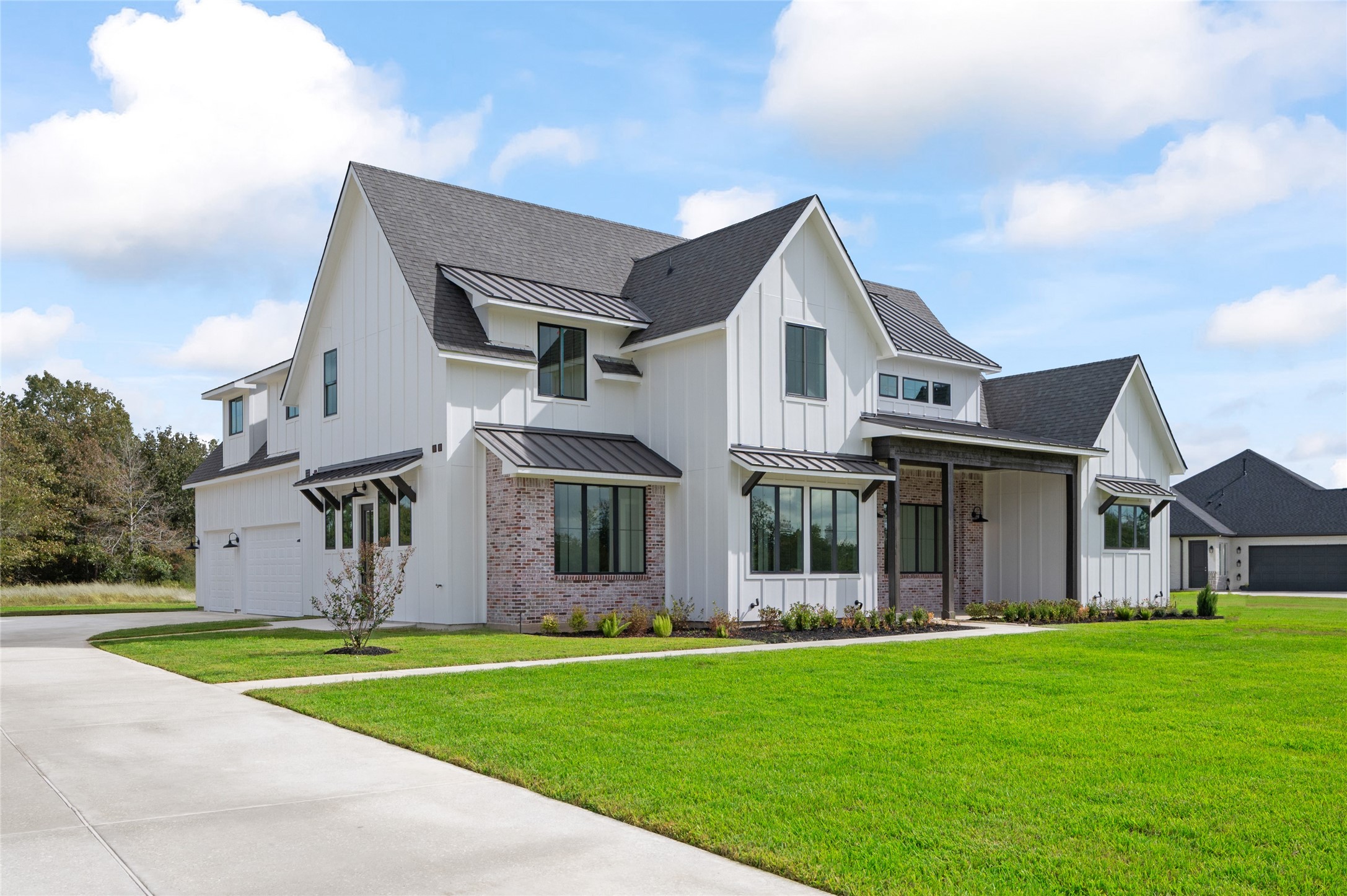 24940 Hopeview Way Montgomery, TX 77356 - Photo 5 of 49 a view of a white house with a big yard and large trees