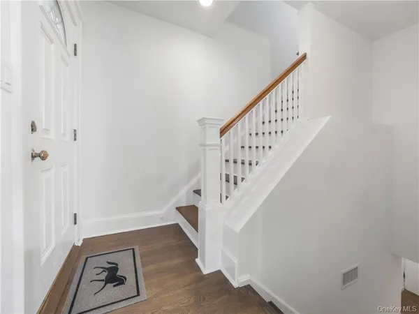 a view of a hallway with stairs