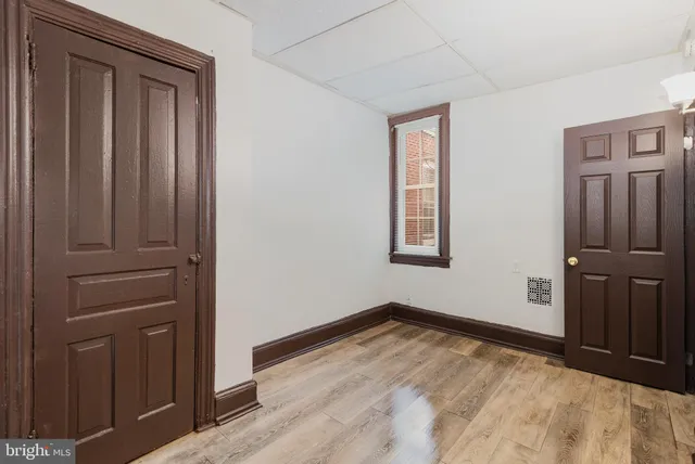 an empty room with closet area
