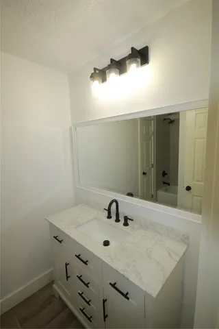 a bathroom with a toilet and a bath tub