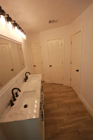 a room with a sink and shower