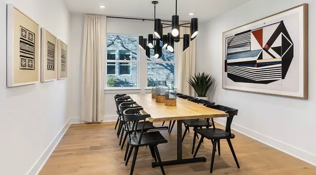 a bedroom with a bed a window and dresser