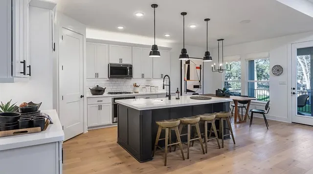 a bathroom with a double vanity sink mirror and shower