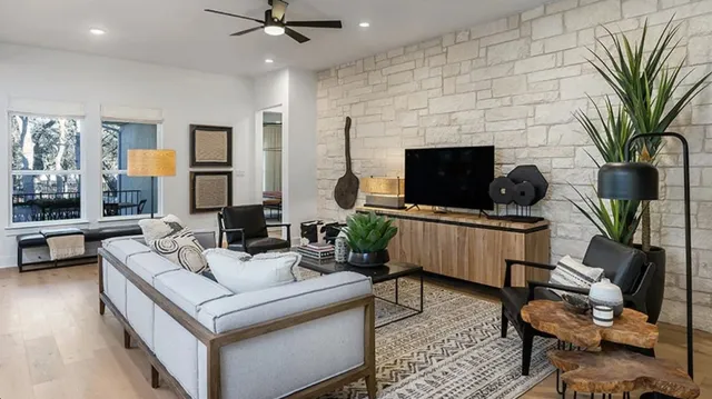 a living room with furniture and a flat screen tv