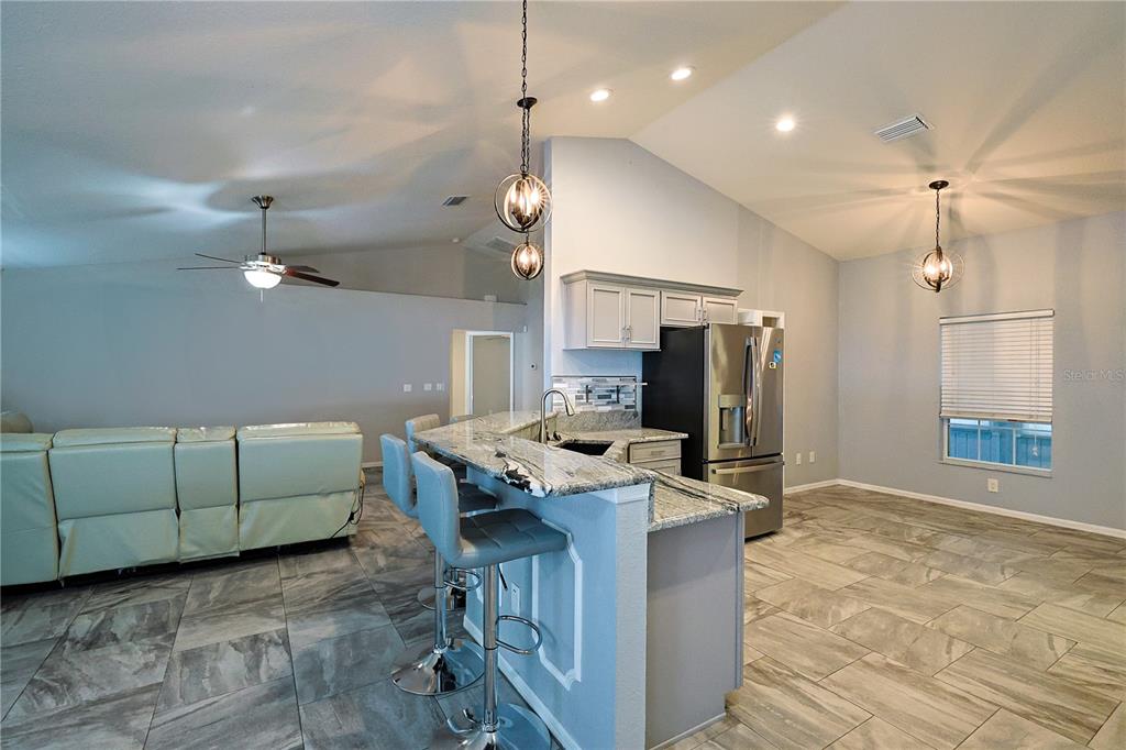 6367 Southwest 117th St Road Ocala, FL 34476 - Photo 14 of 43 a view of kitchen with furniture and a refrigerator
