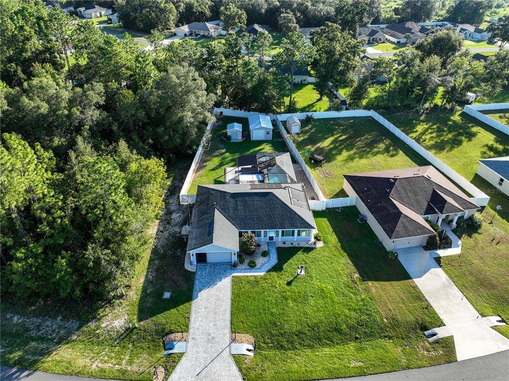 6367 Southwest 117th St Road Ocala, FL 34476 - Photo 2 of 43 an aerial view of a house with swimming pool