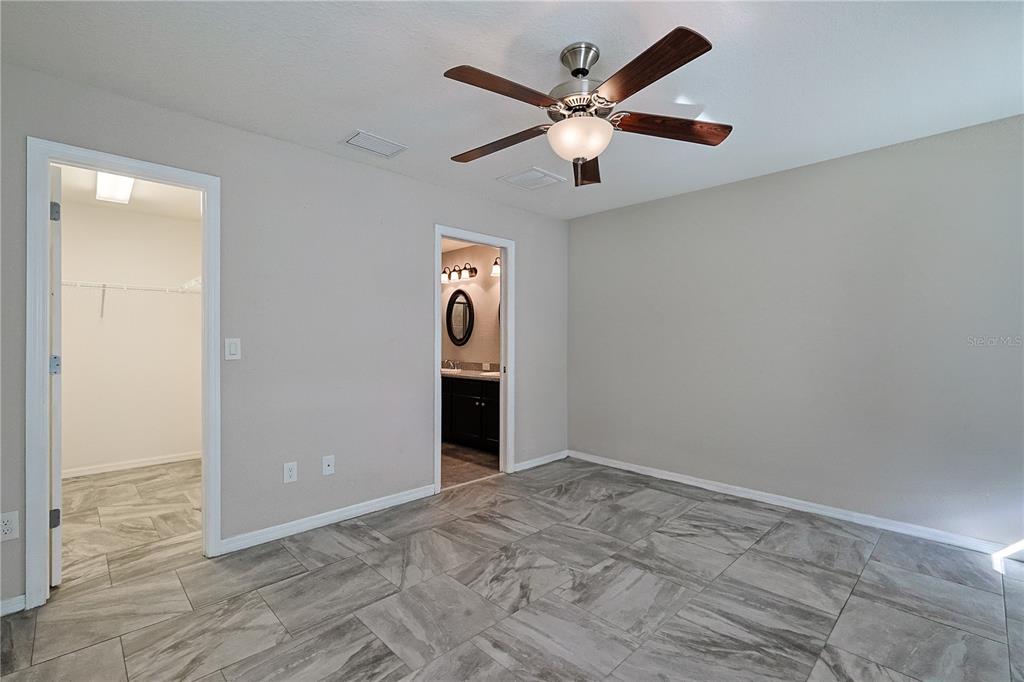 6367 Southwest 117th St Road Ocala, FL 34476 - Photo 24 of 43 an empty room with closet and a ceiling fan