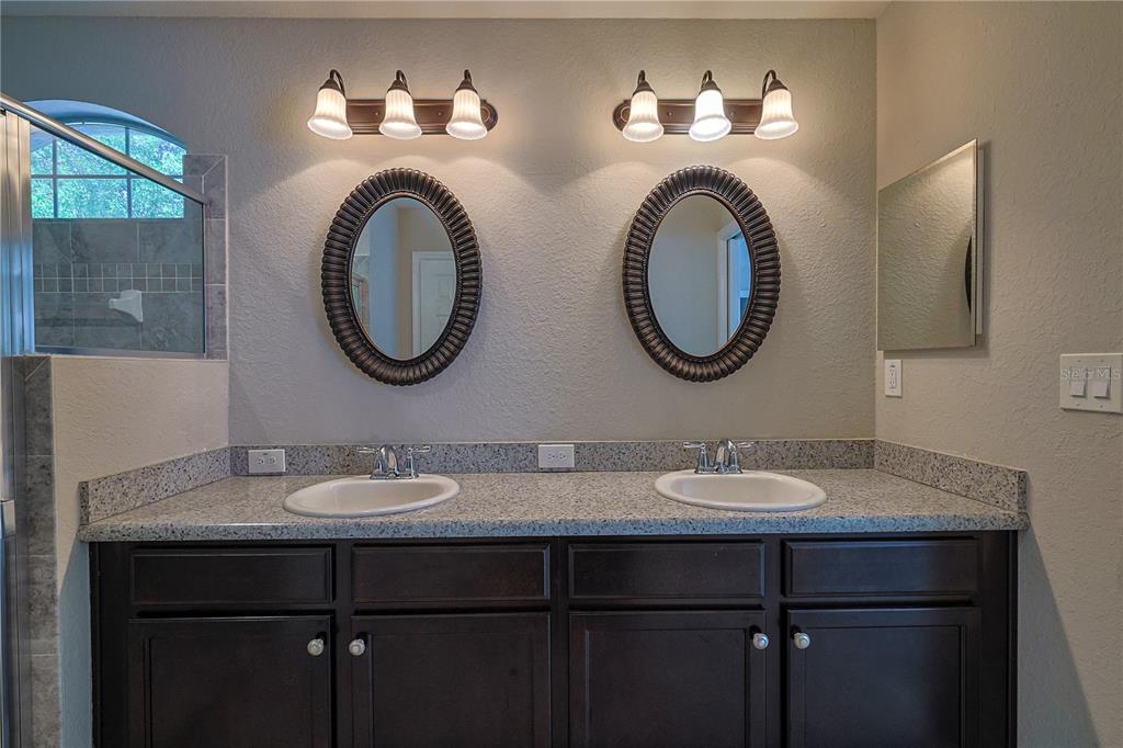 6367 Southwest 117th St Road Ocala, FL 34476 - Photo 28 of 43 a bathroom with a sink and a mirror