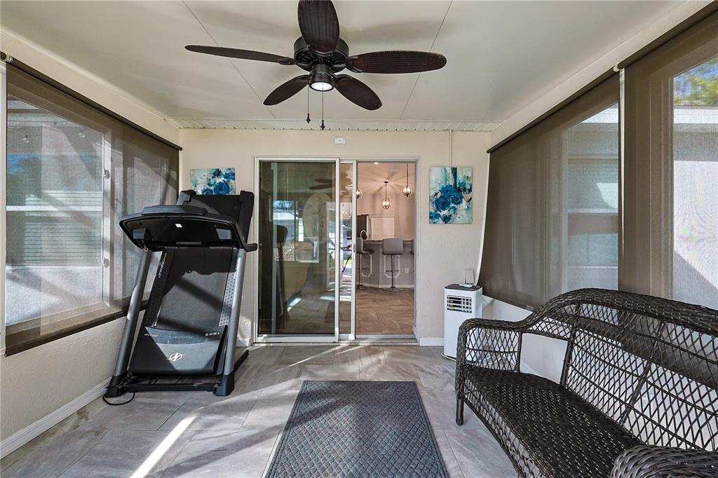 6367 Southwest 117th St Road Ocala, FL 34476 - Photo 30 of 43 a view of a livingroom with furniture and a ceiling fan
