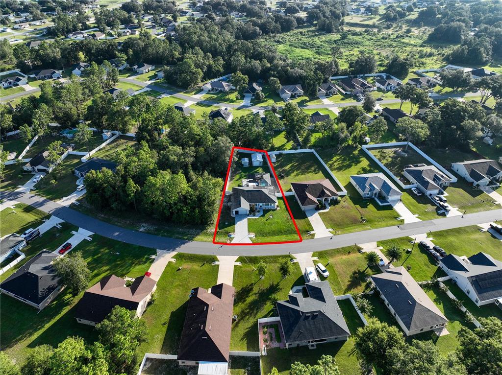 6367 Southwest 117th St Road Ocala, FL 34476 - Photo 3 of 43 an aerial view of residential houses with outdoor space and swimming pool